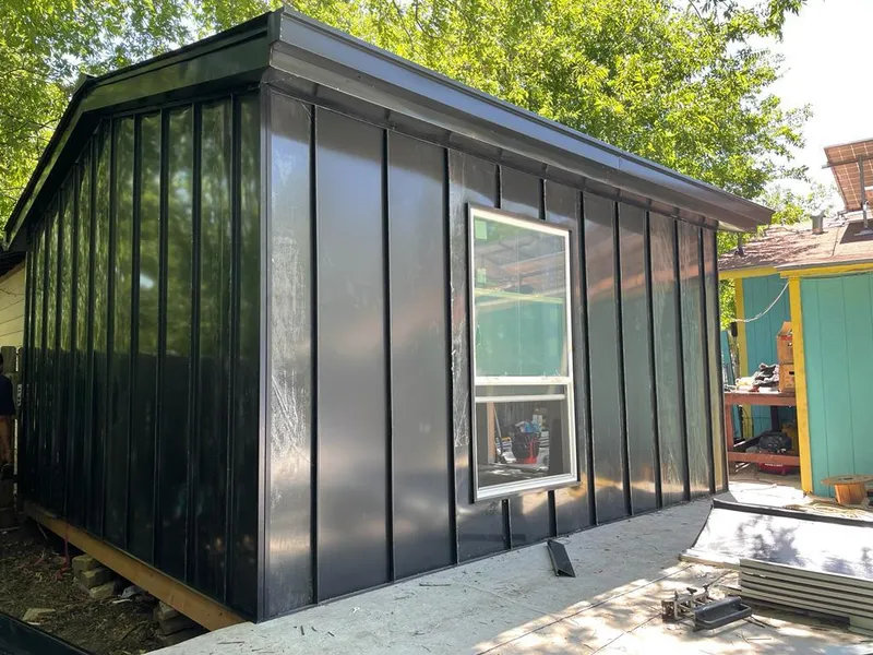 Black standing seam metal wall panels for Roof Inspection in Greenville